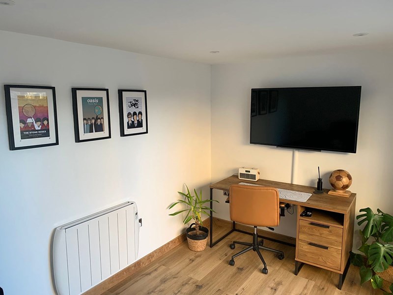 A garden room office with TV and heating
