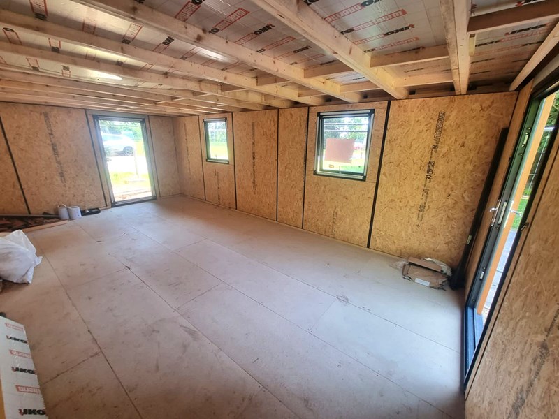 A garden room in mid build showing the roof insulation
